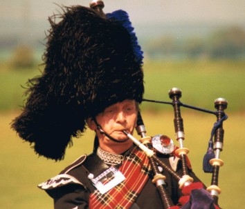 Modern piper playing bagpipes