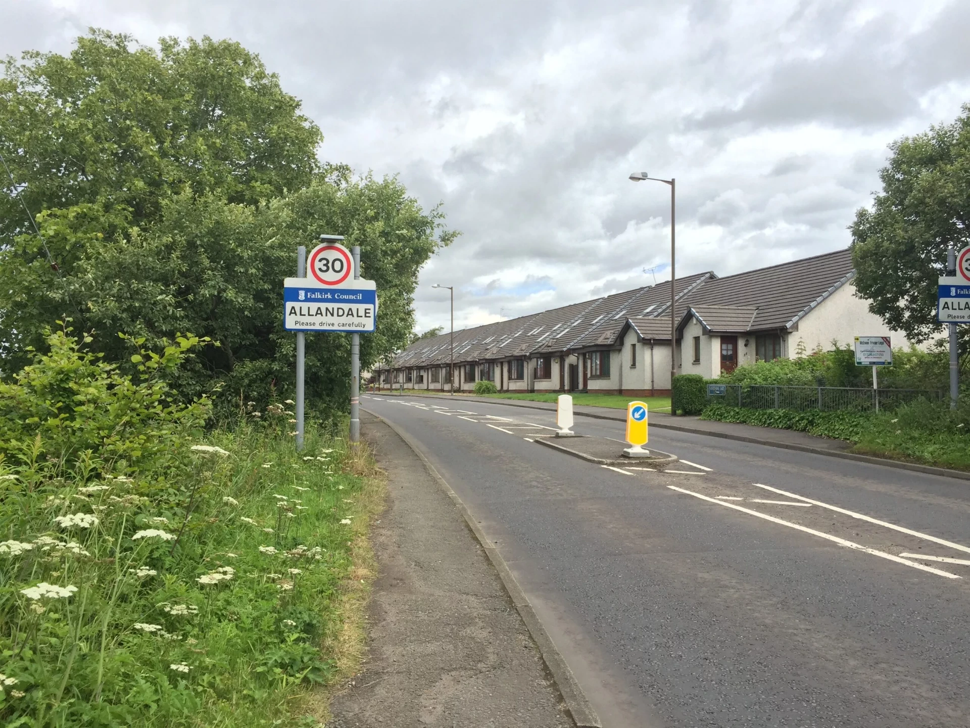 Modern Allandale village sign and contemporary housing
