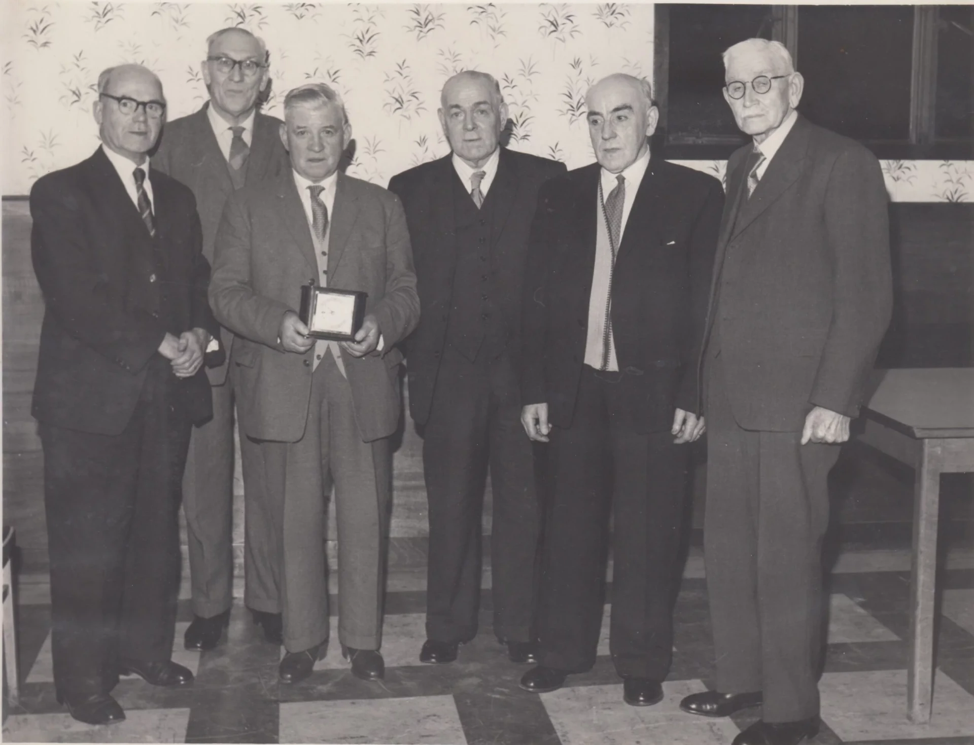 Formal group of workers at a ceremony