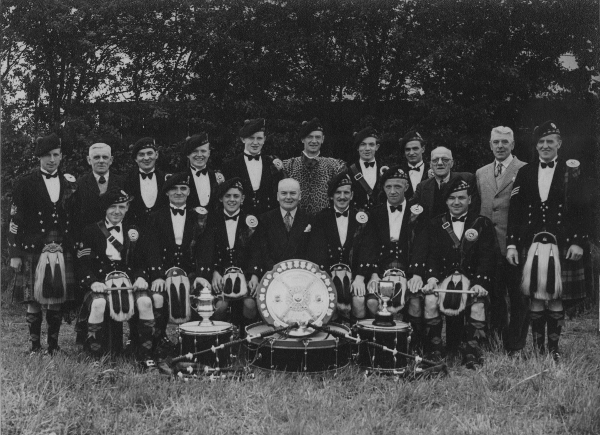 Allandale Pipe Band outdoor photo with trophies in the 1950s