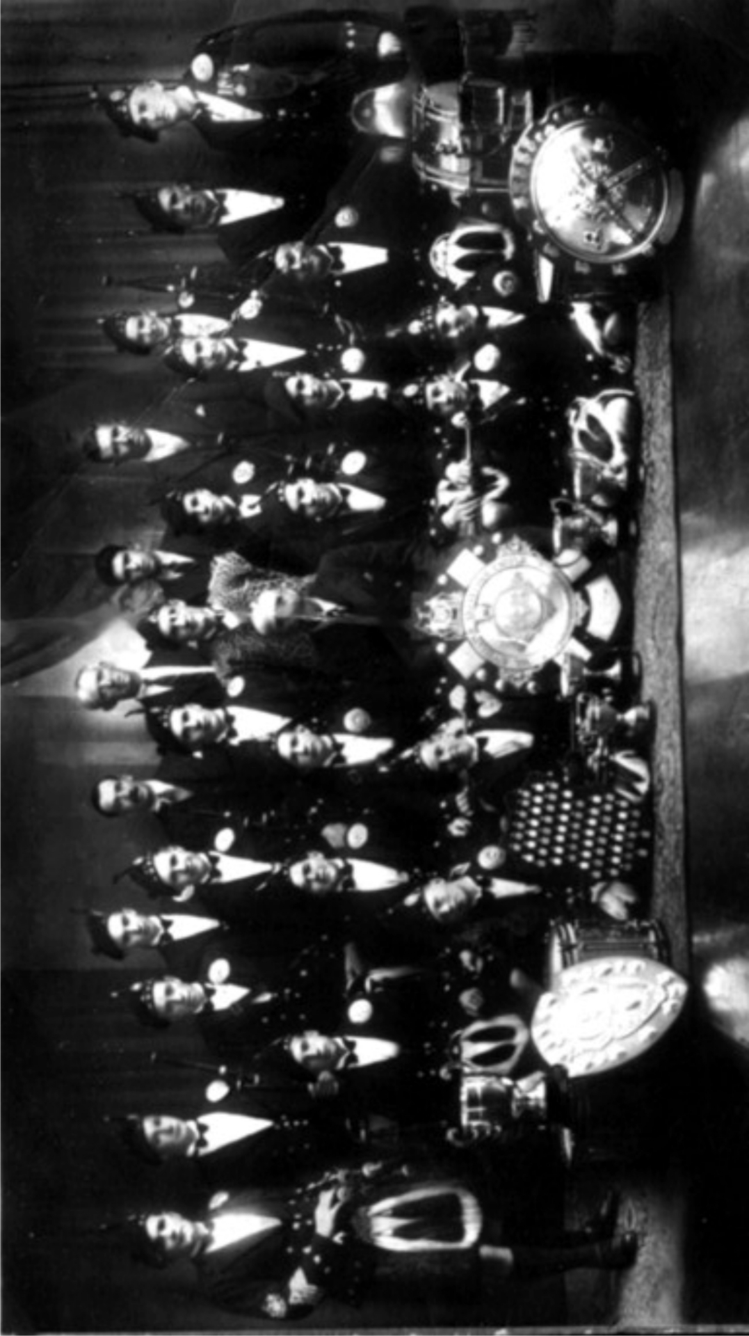 Trophy Collection Overhead View Overhead aerial view of Allandale Pipe Band with complete collection of 1938 championship trophies and 72 medals displayed